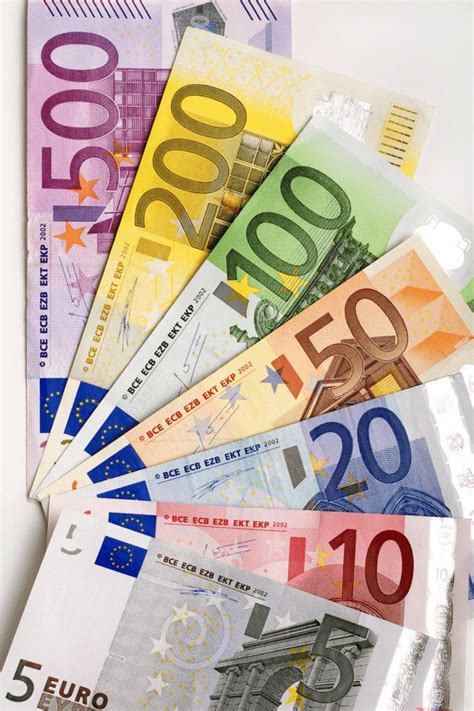 Five Hundred Euros Bills Laid Out On Top Of Each Other In Different Colors And Sizes