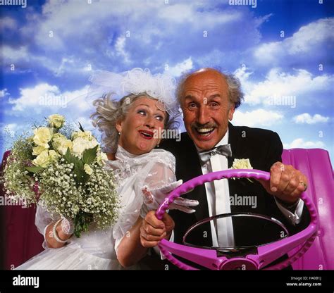 Bride And Groom Senior Citizens Motoring Cabriolet Pink Detail Laugh Joy Honeymoon