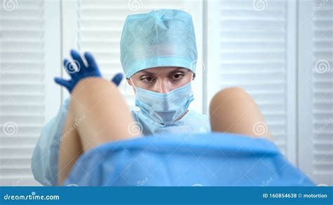 Professional Gynecologist Taking Womans Cervix Sample During