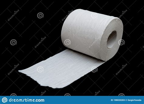 Single Roll Of Unrolled White Toilet Paper Isolated On Black