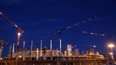 timelapse-with-cranes-working-on-construction-site-on-night-sky-background-concept-of-working