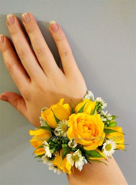Yellow Spray rose and white aster wrist corsage with ...