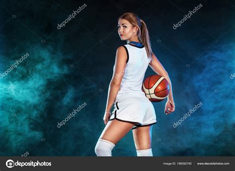 Portrait Of A Beautiful And Sexy Girl With A Basketball In Studio