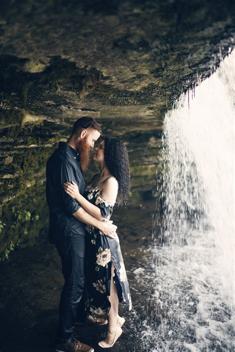 a romantic session behind a waterfall kristen mittlestedt photography moody engagement