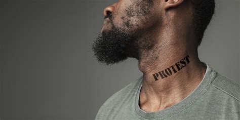 Premium Photo Close Up Portrait Black Man Tired Of Racial Discrimination Has Tattooed Slogan