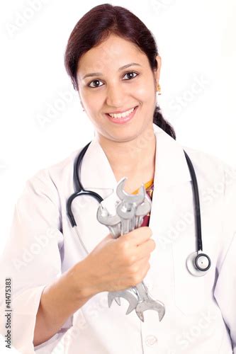 Young Indian Doctor Female Holding Various Size Spanners Buy This