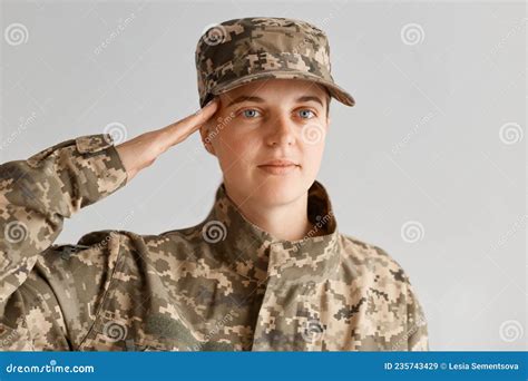 Indoor Shot Of Young Adult Attractive Woman Army Soldier Saluting