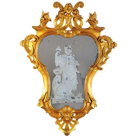 18th Century Italian Rococo Cartouche Form Giltwood Mirror With Figure