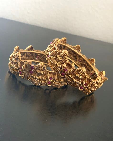 A Pair Of Antique Gold Plated Ad Bangles In Size 26 Bracelets