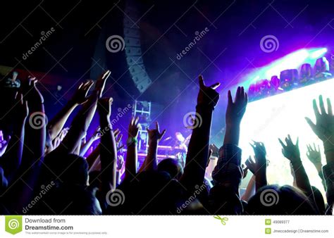 Crowd Of People At A Rock Concert With Hands In The Air