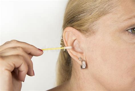 Woman Cleaning Her Ear With A Swab Stock Image Image Of Healthy Face