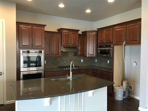 Island countertop is soapstone, 3cm thick with a chipped face edge. Timberlake Sierra Vista Cabinets, One Quartz Concrete Gray ...