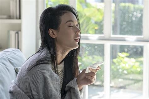 Ill Young Asian Woman Covered With Blanket Blowing Running Nose Got