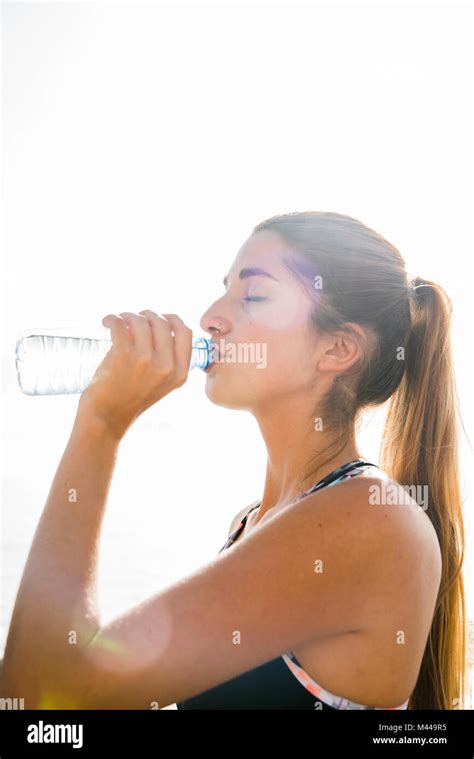 Young Woman Training Drinking Bottled Water Stock Photo Alamy