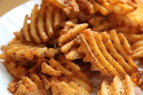Heat the canola oil in a big dutch oven set to 400 degrees. Blackened Cajun Waffle Cut Fries Recipe | Eat the Love