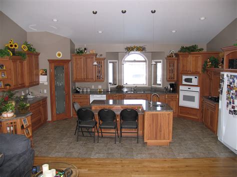A kannapolis kitchen does a makeover with caledonia granite with a half bullnose edge, a 60/40 sink and finishes it off with 4x4 light travertine tiles in a subway design. Cabinets: Hickory (NLA) - Mellow with Chocolate Glaze ...