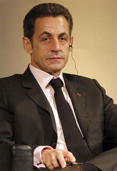 Nicolas has black hair and a receding hairline. Op-Ed: Is Nicolas Sarkozy planning his reelection strategy?