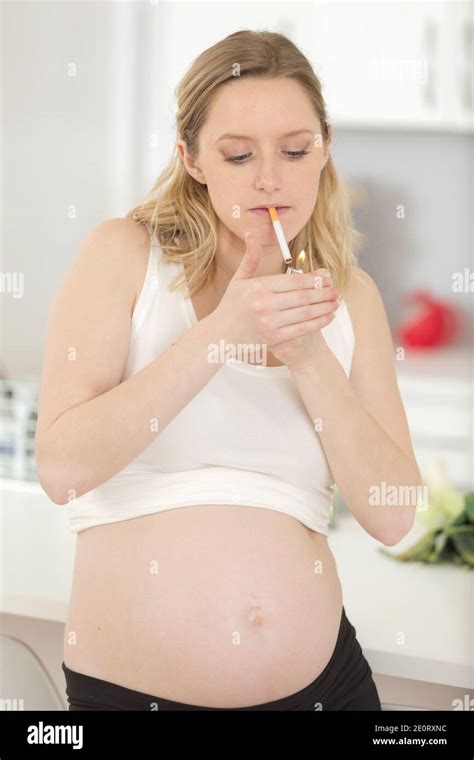 Close Up Of Pregnant Woman Smoking Cigarette Stock Photo Alamy