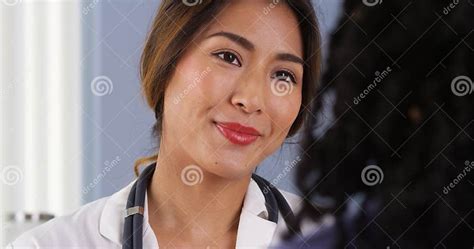 Closeup Of Japanese Doctor Smiling At Patient Stock Image Image Of Closeup Female 47559377