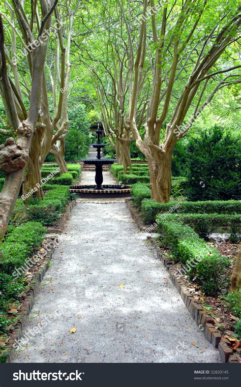 Capitol Hill Garden Is Landscaped In Formal Design With Waterfountains