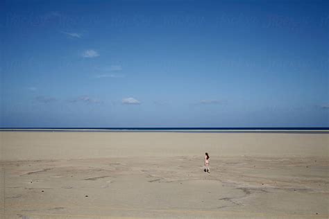 Nude Woman Walking On Huge Empty Beach By Stocksy Contributor Rene