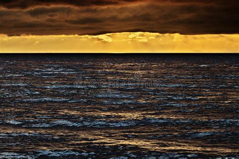 Seascape At Sunset With Stunning Nimbostratus Cloud Formation Over The