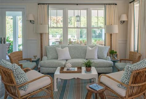 Blue Cottage Living Room Features A Blue Roll Arm Sofa Lined With Snow