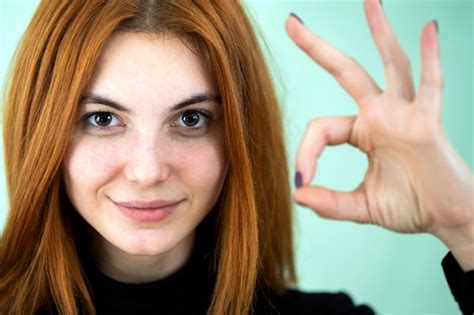 Premium Photo Funny Pretty Redhead Girl Showing Ok Sign With Her Fingers