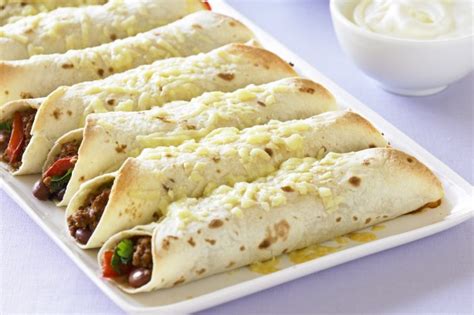 Spoon about 1/4 cup beef mixture onto center of each tortilla. Beef And Bean Burritos Recipe - Taste.com.au