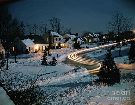 Neighborhood At Night By Bettmann