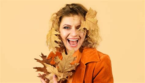 Happy Woman In Orange Jacket With Yellow Leaves Fashion Autumn Girl Fresh Skin Healthy Smile