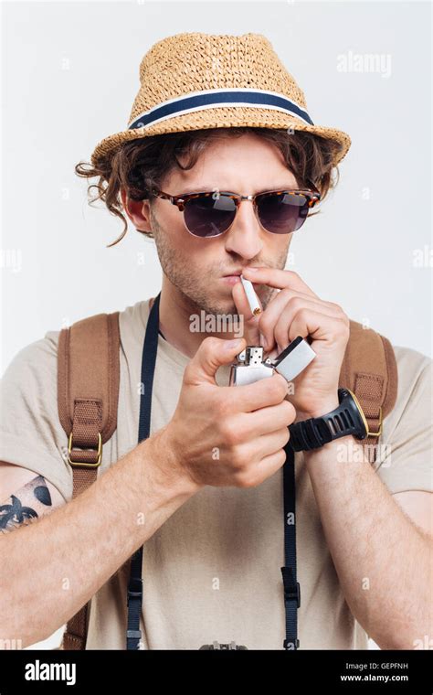 Young Stylish Man With Retro Camera Smoking Cigarette Isolated On A