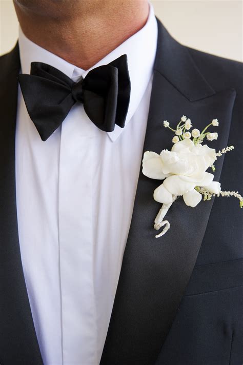 The Groom Who Wore A Handsome Suit And Bow Tie Wore A Floral