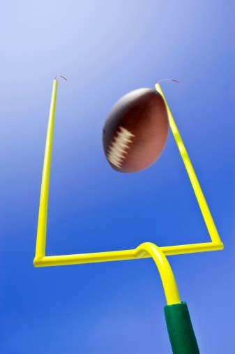 Ball Kicked During Field Goal In Game Of American Football Stock Photo
