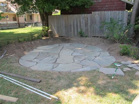We did about 4 per section. How to Install a Flagstone Patio with Irregular Stones ...