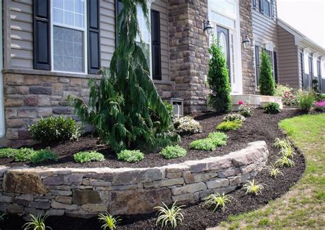 A Planter Formed From A Dry Stacked Retaining Wall Was Made To Mat In