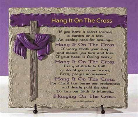 A Cross With Purple Ribbon Hanging From Its Side And The Words Hang On