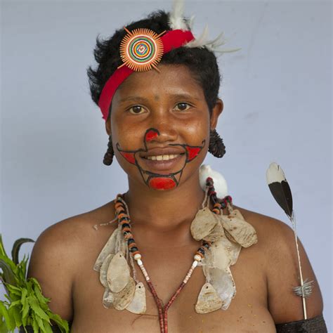 Portrait Of A Smiling Tribal Woman In Traditional Clothing Milne Bay Province Trobriand Island