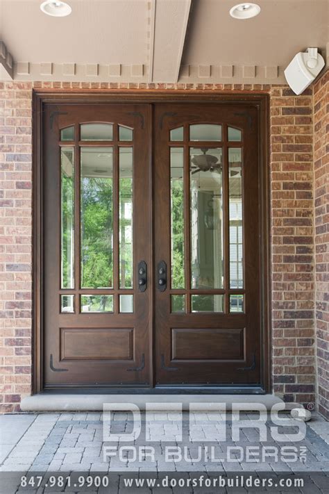 We are so excited to finally share what's behind these doors! Wooden Door with Beveled Glass and Prairie Grills | Custom Wood Front Entry Doors | Door from ...