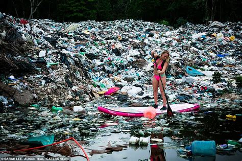 Shocking Images Show Surfer Paddling Through Mounds Of Plastic Trash In