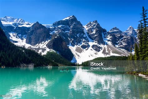 Beautiful Turquoise Water Of The Moraine Lake With Snowcovered Valley