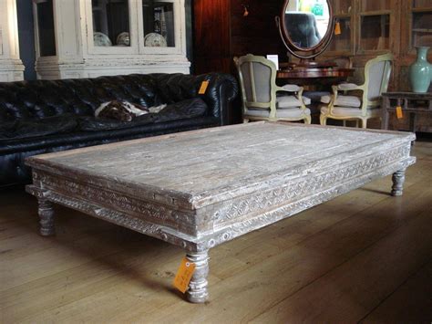 Exceptional carved hard wood with 4 elephant motif legs and carved full figured elephants accenting the top. The Best Indian Coffee Tables