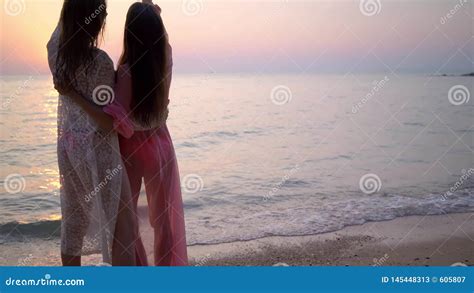 happy female lesbian couple resting on beautiful tropical beach the