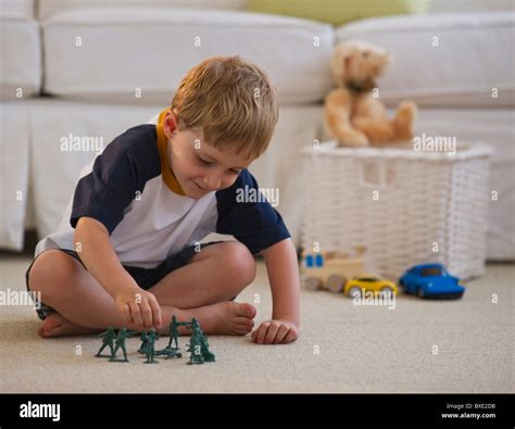 Young Boy Playing With Toy Soldiers Stock Photo Alamy