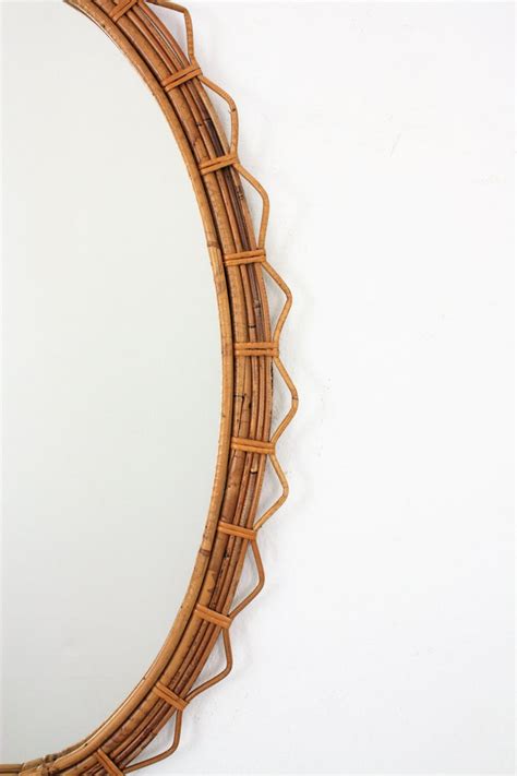 Hand crafted from rattan this mirror with its nautical theme makes for the perfect wall decoration whether you live close or far from the coast. Large 1950s French Riviera Bamboo and Rattan Jagged Edge ...