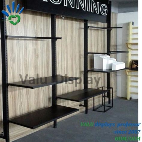 The wall mounted display rack is designed so that the hanging clothing will face outward. China Metal Wall Rack Clothes Display Hanger Rack for ...