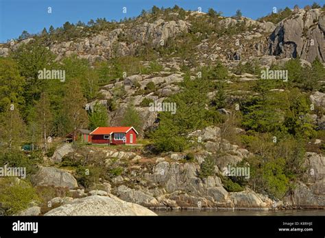 Red Painted Wooden Vacation Houses In Traditional Norwegian Style On