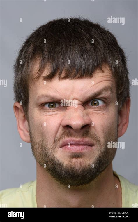 Close Up Portrait Of A Man Funny Frowning Eyebrow Of European