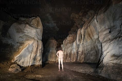 New Zealand Crazy Paving Caves Rear View Of Nude Man Stock Photo