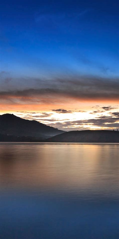 1080x2160 Mountains Silhouette Lake Sunset Wallpaper Beautiful